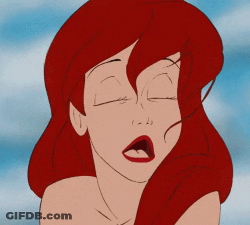 A Close Up Of A Cartoon Girl With Red Hair GIF