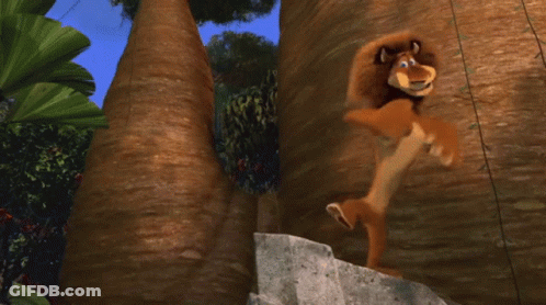 A Close Up Of A Cartoon Lion With Its Mouth Wide Open GIF