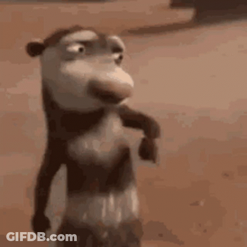 A Close Up Of A Cartoon Opossum Standing On A Sandy Beach . GIF