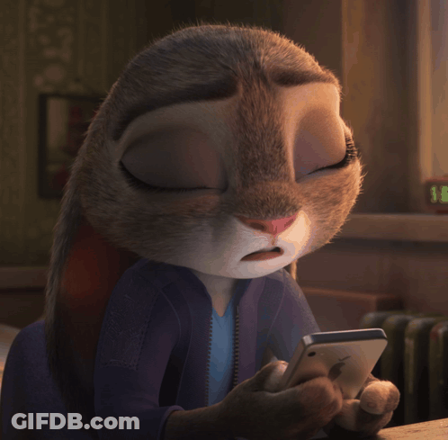 A Close Up Of A Cartoon Rabbit Holding A Phone GIF
