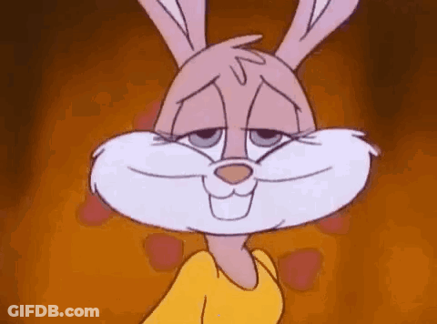 A Close Up Of A Cartoon Rabbit Wearing A Yellow Shirt And Smiling . GIF