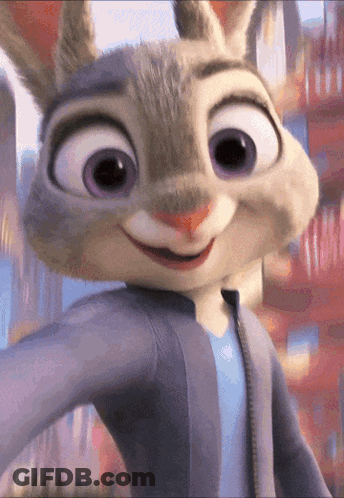 A Close Up Of A Cartoon Rabbit With Purple Eyes Smiling GIF