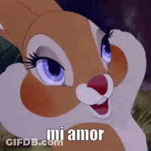 A Close Up Of A Cartoon Rabbit With The Words `` Mi Amor '' On It . GIF