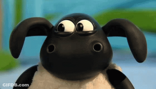 A Close Up Of A Cartoon Sheep With Big Eyes Looking At The Camera GIF