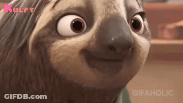 A Close Up Of A Cartoon Sloth Making A Funny Face And Smiling . GIF