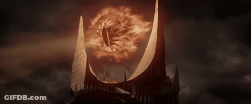 A Close Up Of A Castle With A Burning Eye In The Middle Of It . GIF