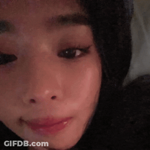 A Close Up Of A Cat 'S Face Looking At The Camera GIF