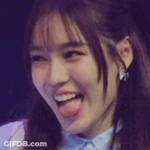 A Close Up Of A Cat 'S Face With Its Tongue Out GIF