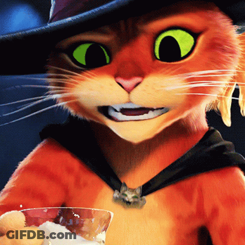 A Close Up Of A Cat With Green Eyes Holding A Glass GIF