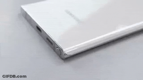 A Close Up Of A Cell Phone With A Pencil Plugged In . GIF
