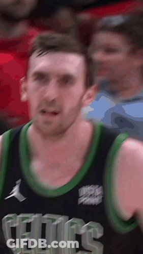 A Close Up Of A Celtics Basketball Player Wearing A Black Jersey GIF