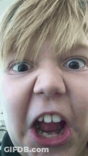 A Close Up Of A Child Making A Funny Face GIF