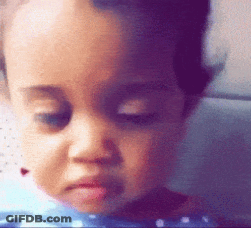 A Close Up Of A Child 'S Face Making A Funny Face GIF