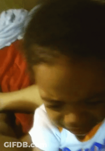 A Close Up Of A Child 'S Face With A Blue Shirt On That Says ' Nba ' On It GIF