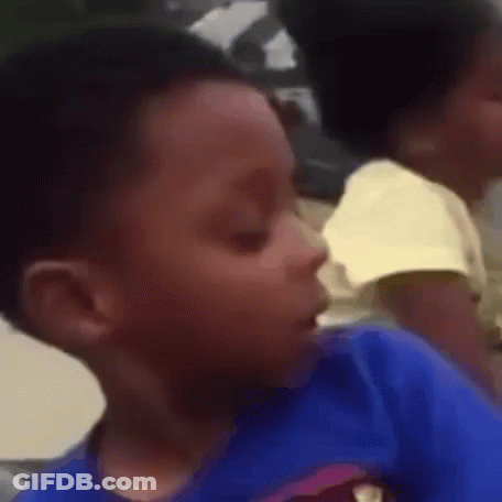 A Close Up Of A Child 'S Face With A Blurry Background GIF