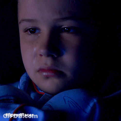 A Close Up Of A Child 'S Face With A Tear Coming Out Of His Eye And The Words #Speedracer On The Bottom GIF