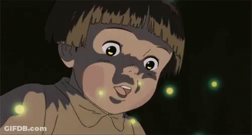 A Close Up Of A Child 'S Face With Fireflies Coming Out Of It 'S Mouth . GIF