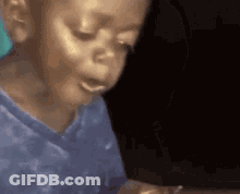 A Close Up Of A Child 'S Face With His Eyes Closed GIF