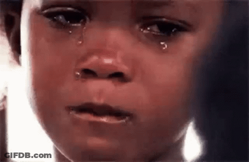 A Close Up Of A Child 'S Face With Tears Running Down It . GIF
