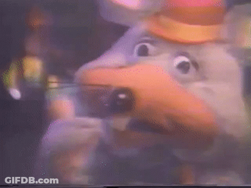 A Close Up Of A Chuck E Cheese Character With A Hat On GIF