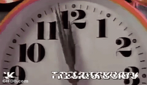 A Close Up Of A Clock With The Words " The Clockwork " Written Below It GIF