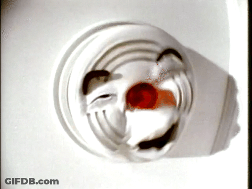A Close Up Of A Clown 'S Face On A White Background GIF