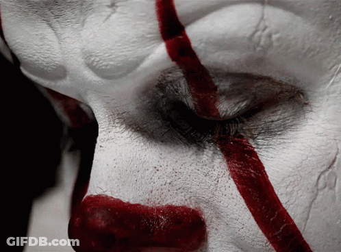 A Close Up Of A Clown 'S Face With Red Lines GIF