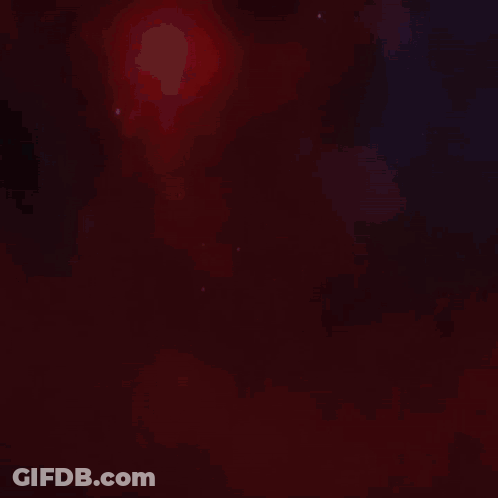 A Close Up Of A Colorful Dragon 'S Head With A Red Background GIF