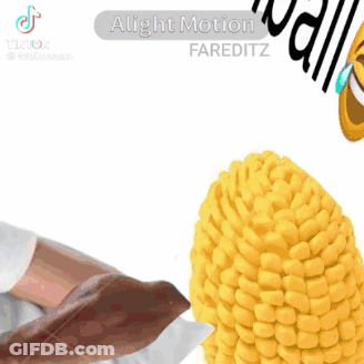 A Close Up Of A Corn On The Cob With A Person 'S Ear On It . GIF