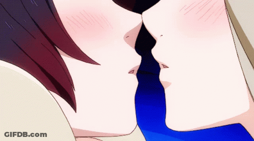 A Close Up Of A Couple Kissing With A Blue Tie GIF