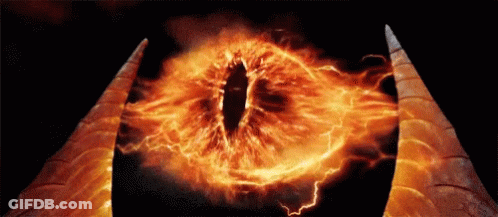 A Close Up Of A Demon 'S Eye With Flames And Lightning Coming Out Of It GIF