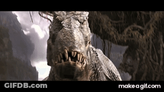 A Close Up Of A Dinosaur 'S Face With A Mountain In The Background GIF