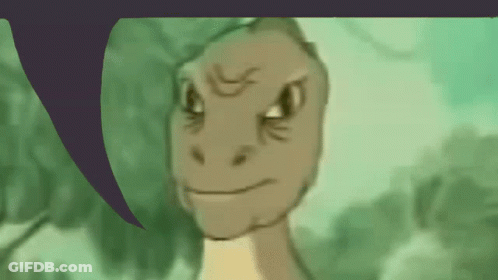 A Close Up Of A Dinosaur 'S Face With A Purple Speech Bubble In The Background GIF