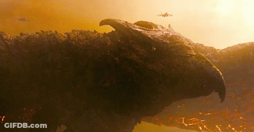 A Close Up Of A Dinosaur 'S Head With A Helicopter In The Background GIF