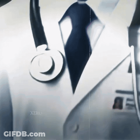 A Close Up Of A Doctor With A Stethoscope On His Jacket GIF