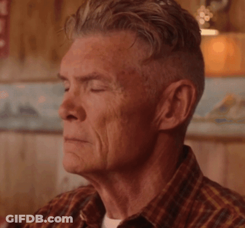 A Close Up Of A Dog 'S Face With His Eyes Closed GIF