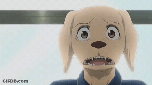 A Close Up Of A Dog 'S Face With Its Mouth Wide Open GIF