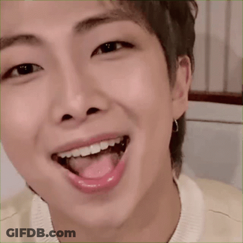 A Close Up Of A Dog With Its Tongue Out GIF