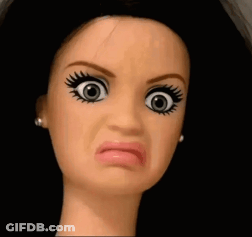 A Close Up Of A Doll 'S Face Making A Face GIF