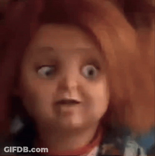 A Close Up Of A Doll 'S Face With A Surprised Look On Her Face . GIF