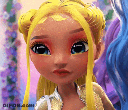 A Close Up Of A Doll 'S Face With Yellow Hair GIF