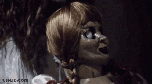 A Close Up Of A Doll With A Braided Hair GIF