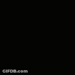 A Close Up Of A Donut With A Smiley Face On It 'S Face . GIF