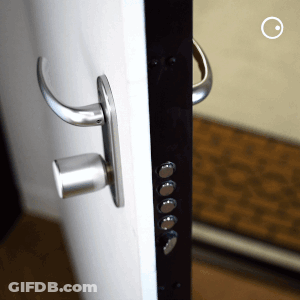 A Close Up Of A Door With A Handle GIF