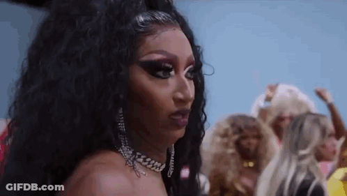 Close Up Of Drag Queen Wearing Choker And Earrings GIF