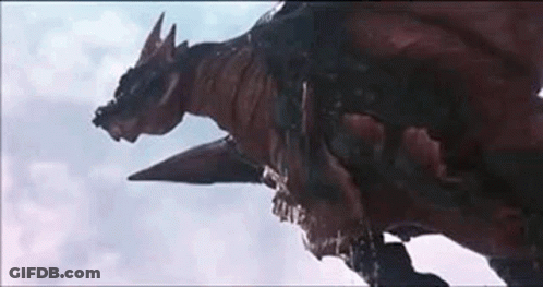 A Close Up Of A Dragon Flying Through The Air . GIF