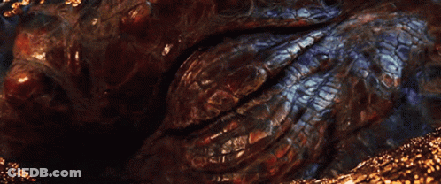 A Close Up Of A Dragon 'S Eye With A Light Shining Through GIF