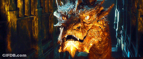 A Close Up Of A Dragon 'S Face Looking At The Camera GIF