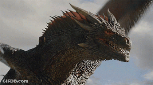 A Close Up Of A Dragon 'S Head Against A Blue Sky GIF