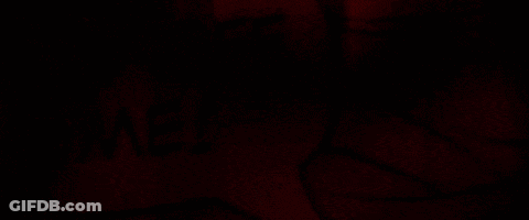 A Close Up Of A Drawing Of A Person 'S Face With A Red Background GIF